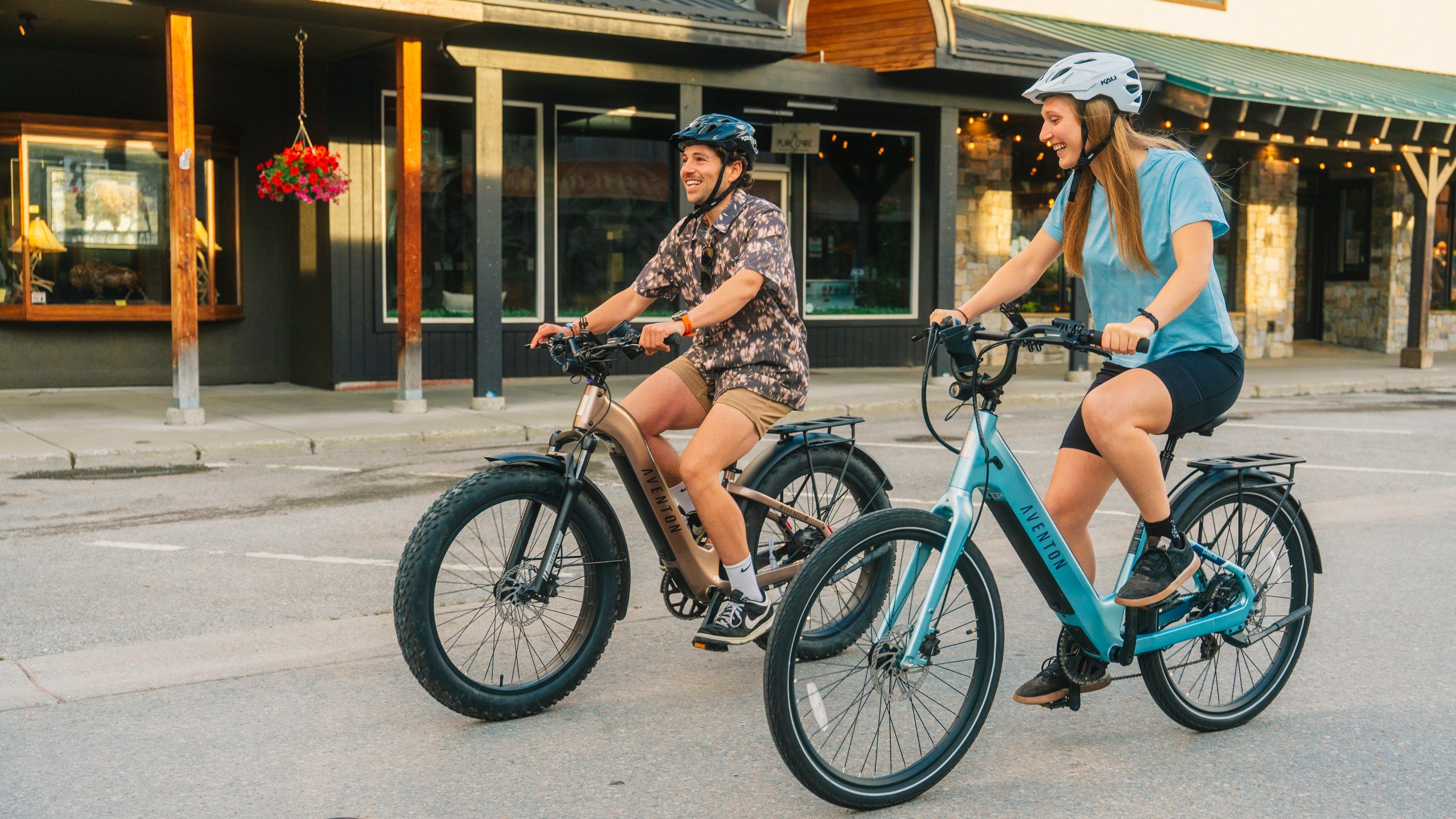 Two riders on Montana E-Bikes rentals on Central Avenue in downtown Whitefish