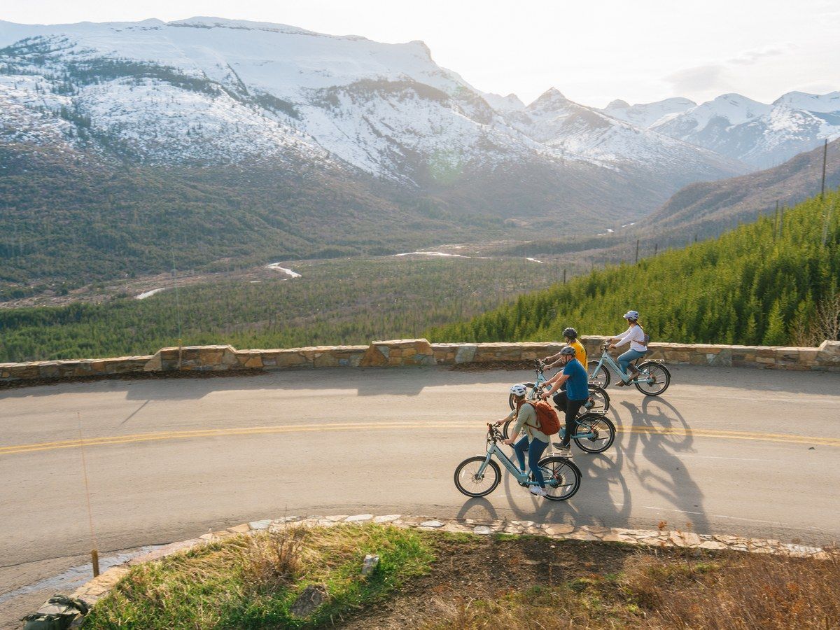 An e-bike rider on Going-to-the-Sun Road in Glacier National Park on a clear fall day